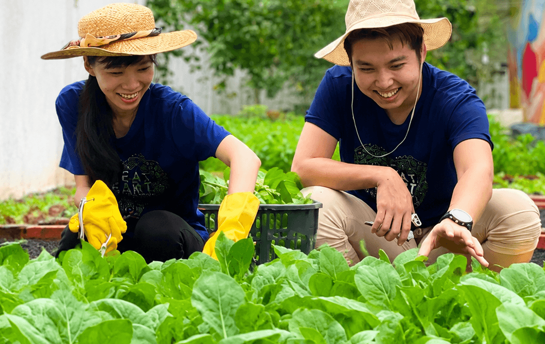Great Heart volunteers tending a community garden