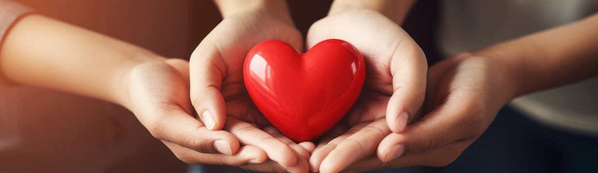 Hands holding a heart