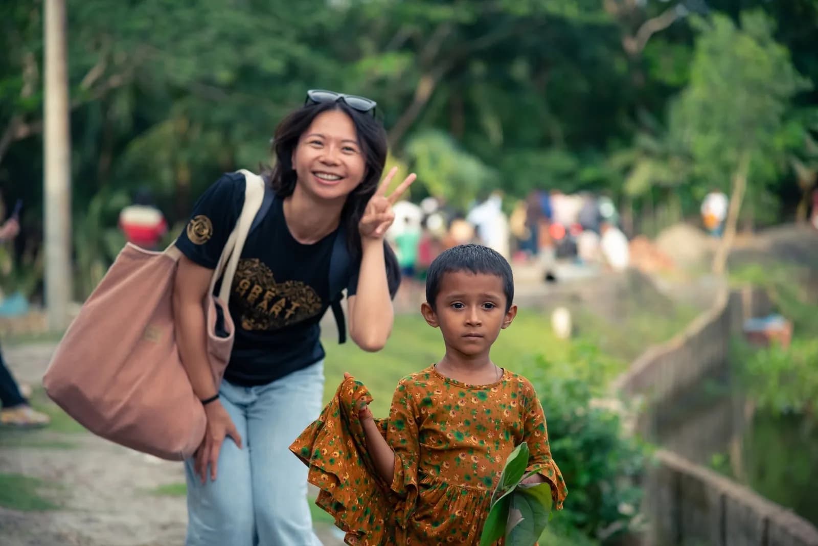 A volunteer meeting a child during a community visit