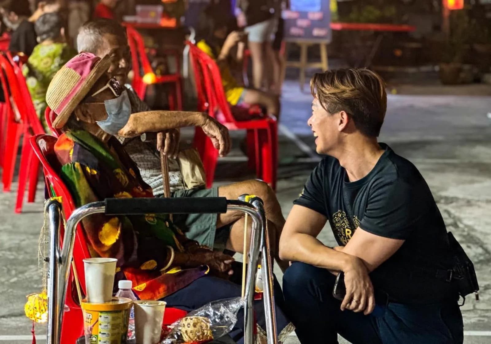 A volunteer listening to an elderly community member