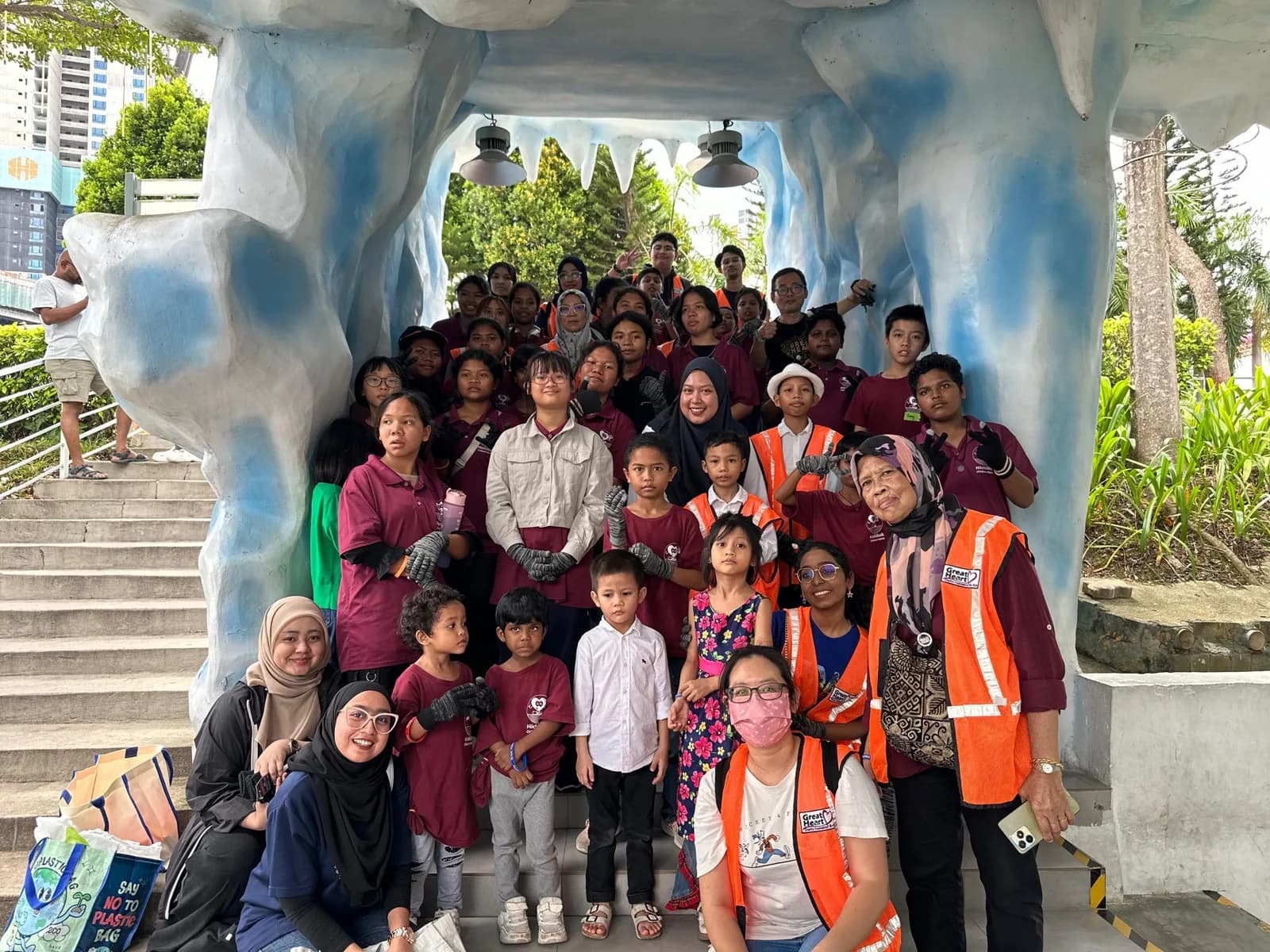 Great Heart volunteers and children at a community activity