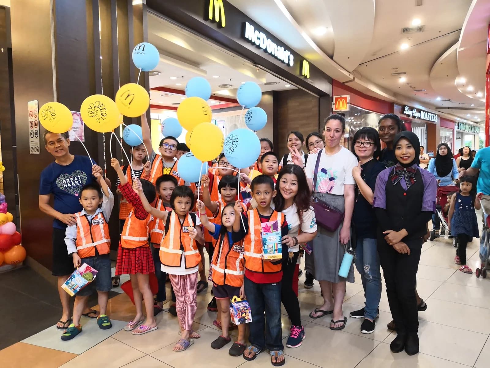 Great Heart volunteers and children at a community outing